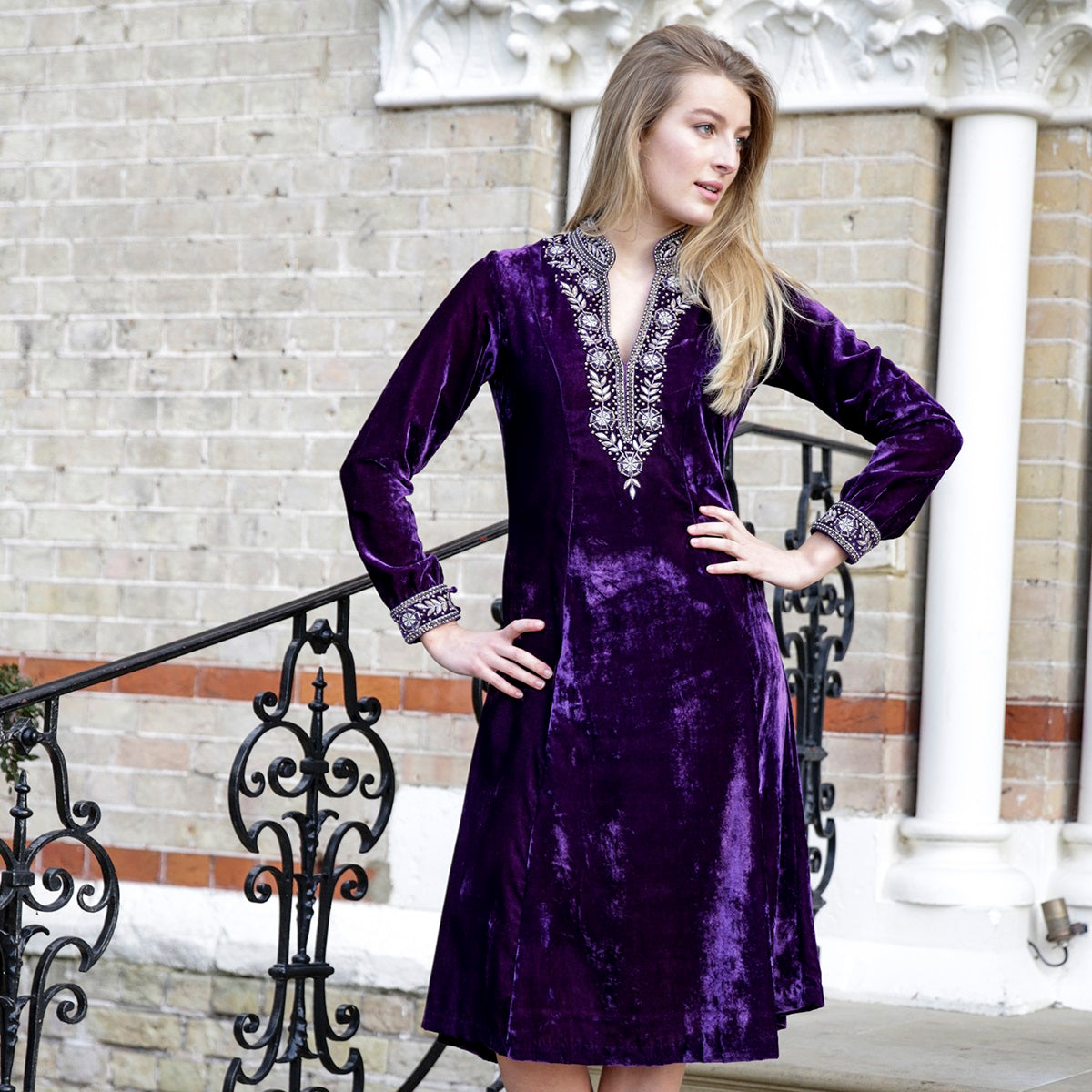 Detail view of purple embroidered velvet dress fabric and drape by Kaminee