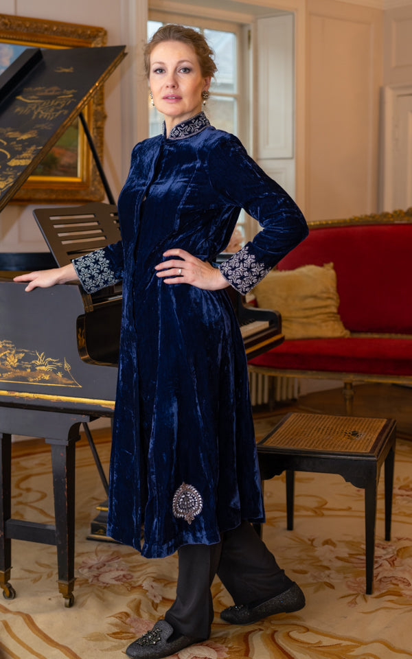 Detail view of midnight blue embroidered velvet swing jacket by Kaminee