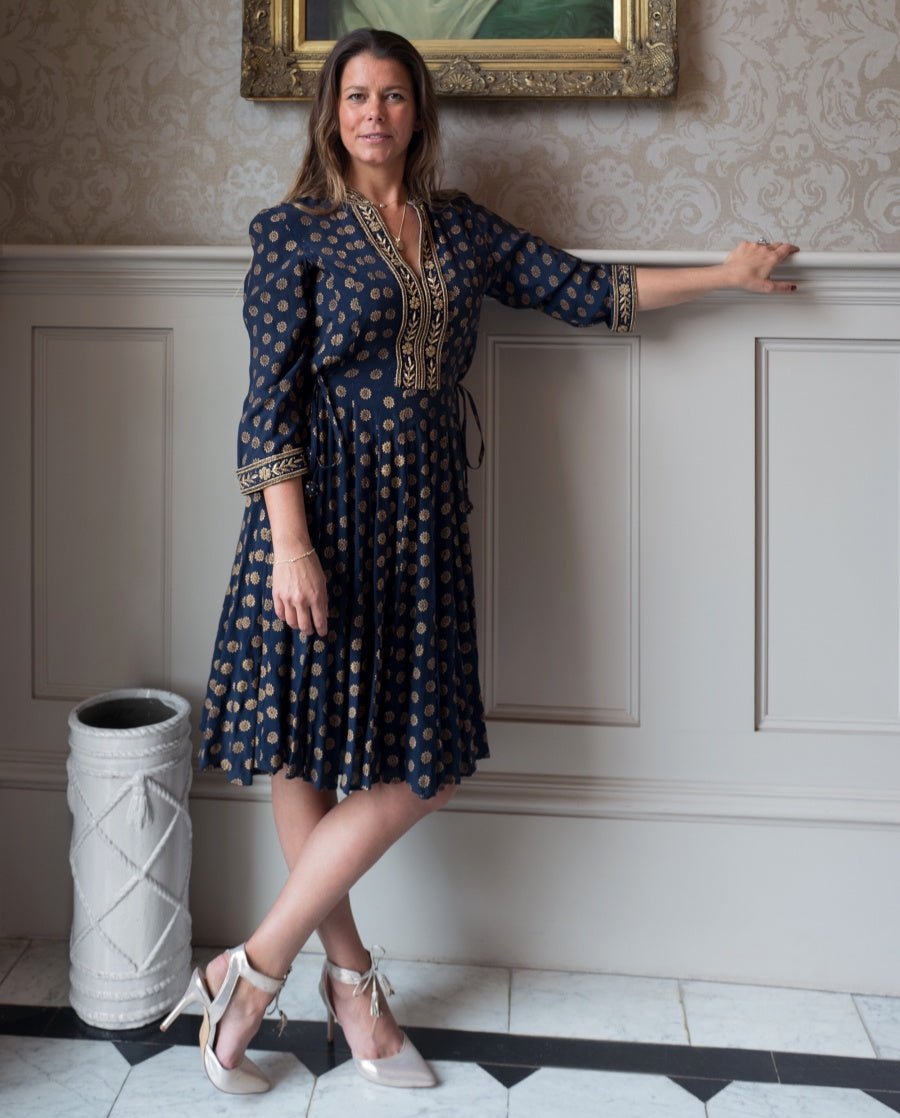 Detail view of navy embroidered silk angharkha dress by Kaminee