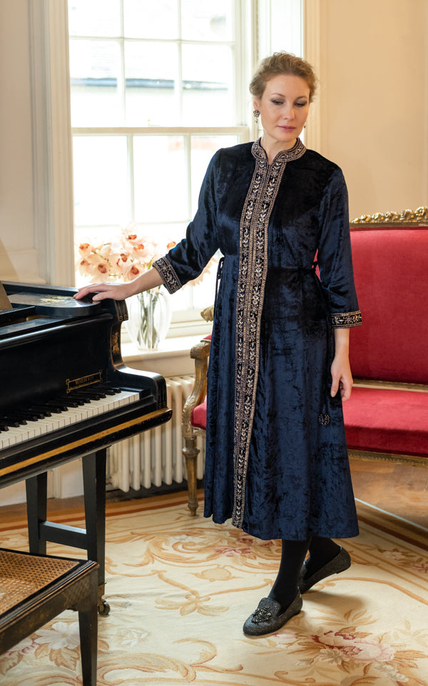 Midnight blue embroidered mid-calf velvet dress with an elegant flowing fit by Kaminee