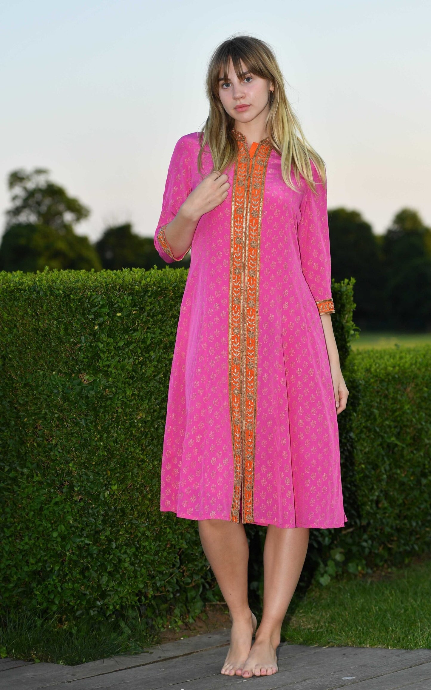 Fuchsia and orange silk swing dress with a full front opening by Kaminee