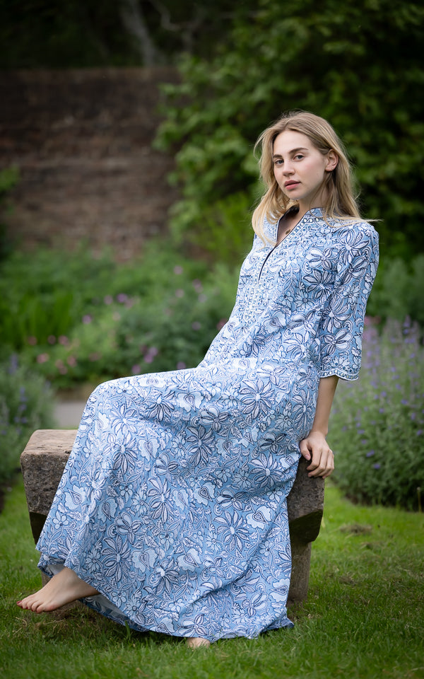 Long blue cotton voile dress with a flowing resortwear silhouette by Kaminee